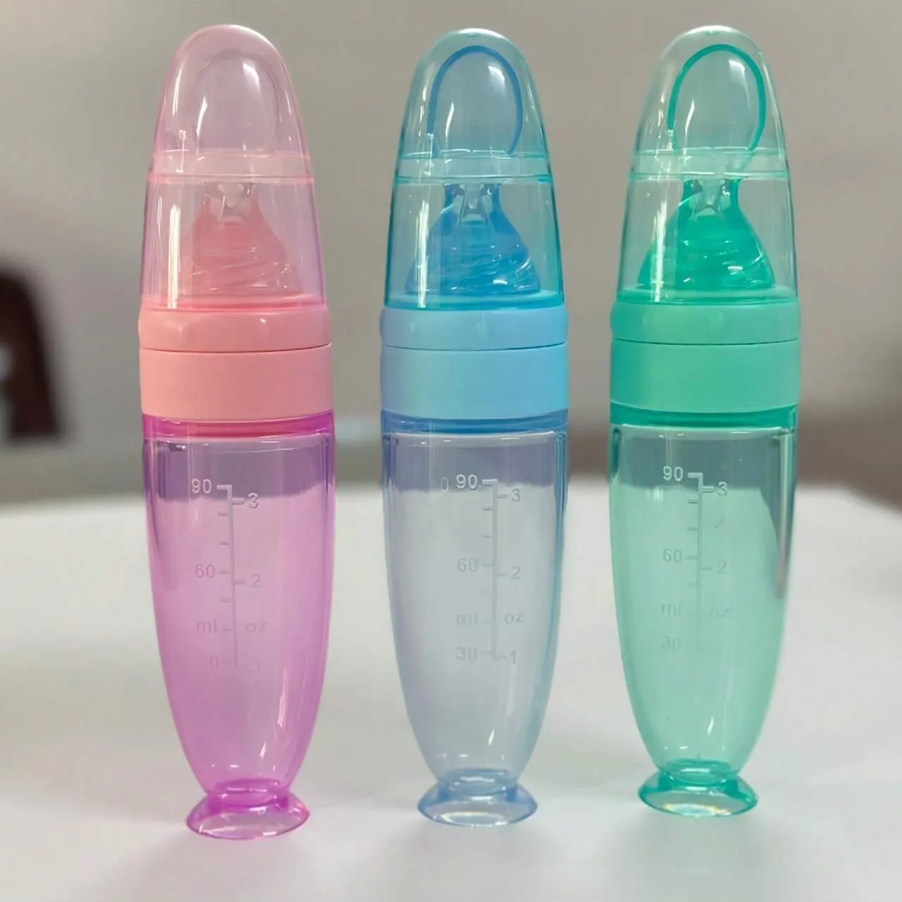 New 90ml/3OZ Colorful Silicone Baby Bottle Feeder with Soft Spoon, Suction Cup and Dust Cap, Portable Squeeze Feeding Bottle